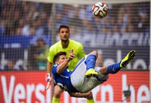 02 May 2015, Gelsenkirchen, Rhineland, Germany --- epa04729962 Schalke's Klaas-Jan Huntelaar (front) and Stuttgart's goalkeeper Sven Ulreich vie for the ball during the German Bundesliga soccer match between FC Schalke 04 and VfB Gelsenkirchen in the Veltins Arena in Gelsenkirchen, Germany, 02 May 2015. (EMBARGO CONDITIONS - ATTENTION - Due to the accreditation guidelines, the DFL only permits the publication and utilisation of up to 15 pictures per match on the internet and in online media during the match) EPA/Bernd Thissen --- Image by © Bernd Thissen/epa/Corbis